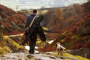 chasseur et chien de chasse